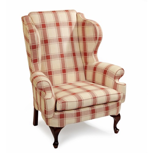 51 - AN UPHOLSTERED WINGBACK ARMCHAIR