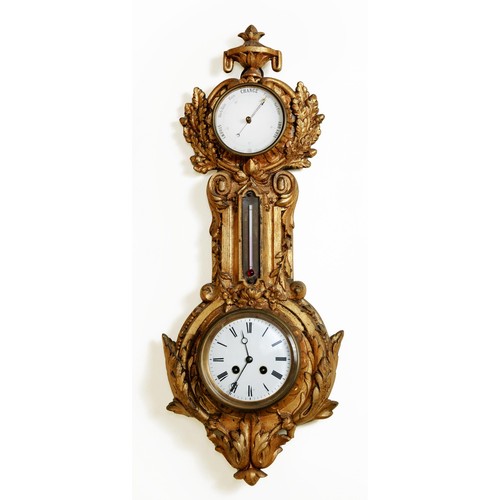 557 - A GILT-METAL CLOCK AND ANEROID BAROMETER