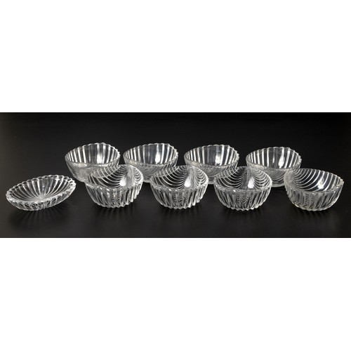 242 - A SET OF EIGHT FLUTED GLASS DESSERT BOWLS