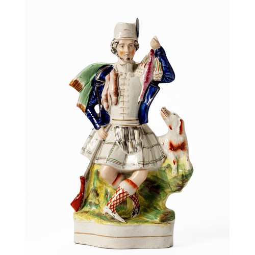 266 - A VICTORIAN STAFFORDSHIRE FIGURE OF SCOTTISH HUNTER