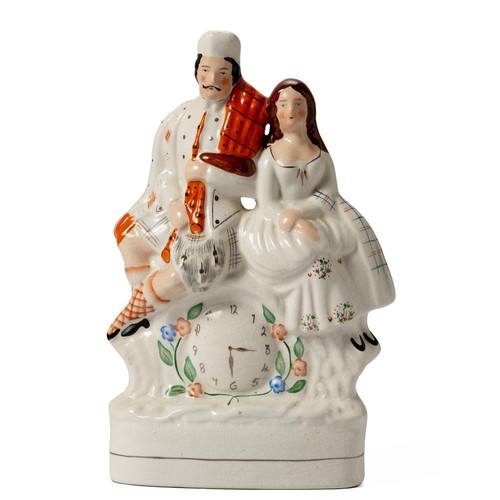 267 - A LARGE VICTORIAN STAFFORDSHIRE FLATBACK FIGURAL GROUP OF A SCOTTISH COUPLE AND A CLOCK