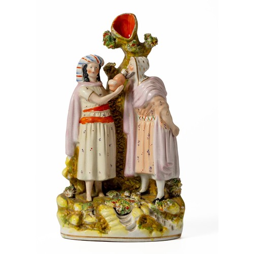 276 - A VICTORIAN STAFFORDSHIRE FIGURAL SPILLVASE OF A COUPLE DRINKING AT A WELL