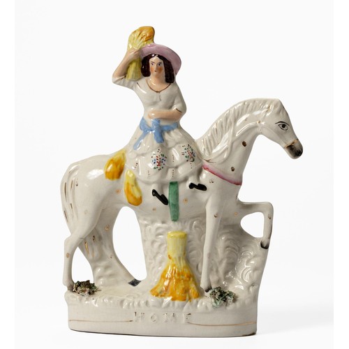 282 - A VICTORIAN STAFFORDSHIRE FLATBACK FIGURE OF A WOMAN ON A HORSE