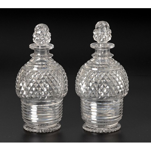 318 - A PAIR OF CUT-GLASS DECANTERS