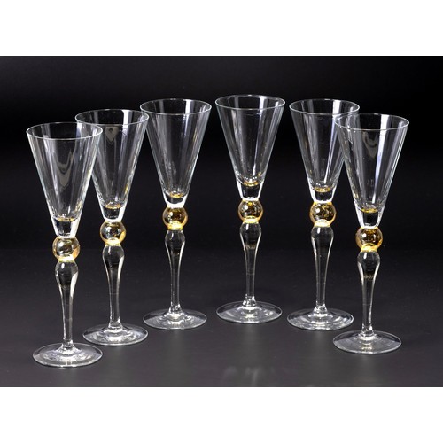 341 - A SET OF SIX CHAMPAGNE FLUTES WITH AMBER KNOPPED STEM