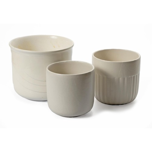 346 - THREE ASSORTED CREAM-GLAZED PLANTERS