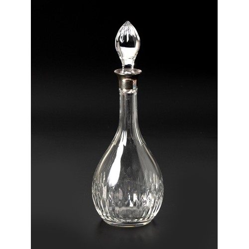 399 - A CUT-CRYSTAL DECANTER WITH SILVER COLLAR