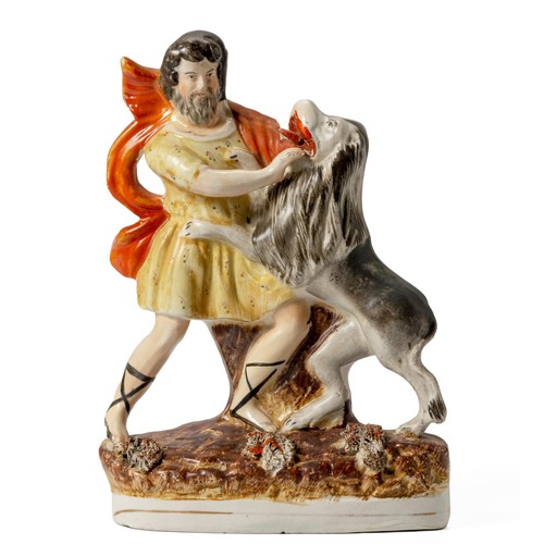 417 - A VICTORIAN STAFFORDSHIRE FIGURE OF SAMSON AND LION