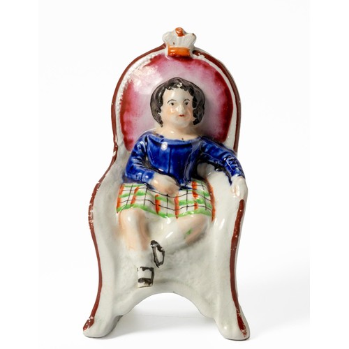 435 - A VICTORIAN STAFFORDSHIRE FIGURE OF THE PRINCE OF WALES SEATED ON A CHAIR