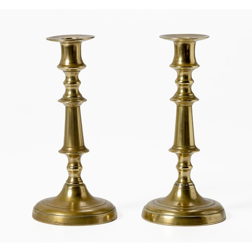 553 - A PAIR OF BRASS CANDLESTICKS