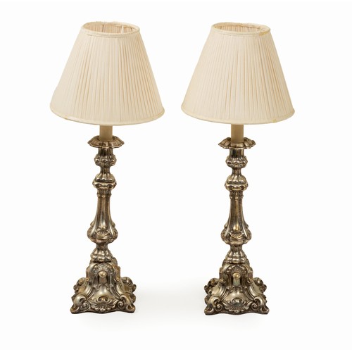 610 - A PAIR OF ELECTROPLATE CANDLESTICKS