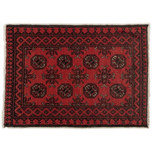 67 - AN AFGHAN RUG 140 by 75cm