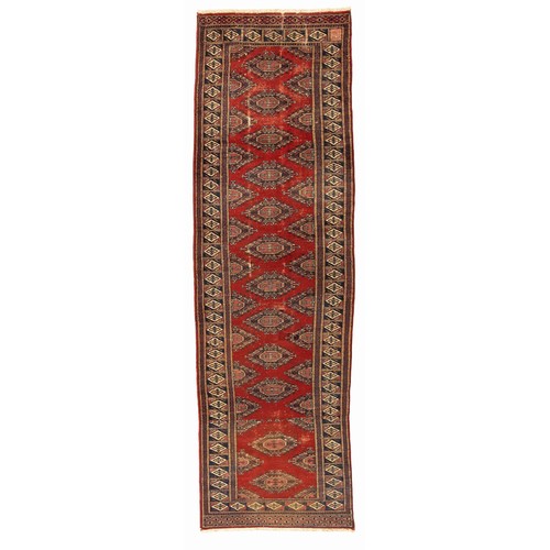 295 - A VINTAGE BOKHARA RUNNER 329 by 81cm