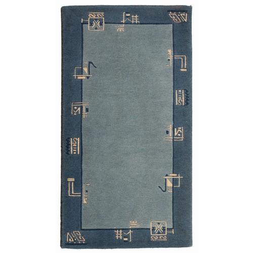 335 - A TIBETAN RUG 140 by 73cm