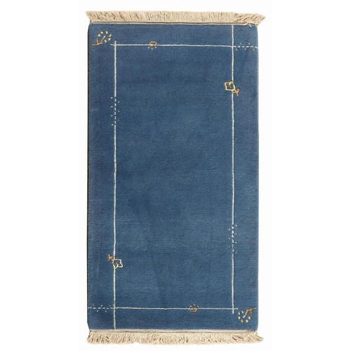 336 - A TIBETAN RUG 137 by 70cm