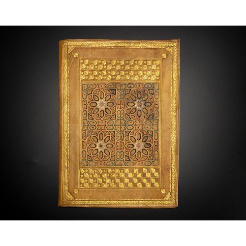 587 - A TOOLED AND GILDED LEATHER MANUSCRIPT COVER