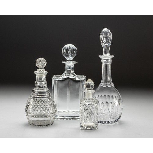 577 - AN ASSORTED COLLECTION OF FOUR CUT-GLASS DECANTERS