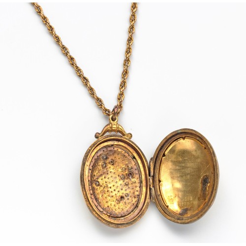 908 - A 9CT GOLD LOCKET