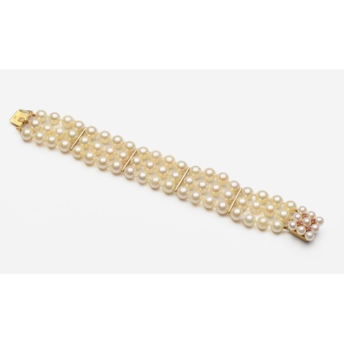 839 - A THREE-STRAND PEARL BRACELET