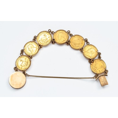 868 - A COIN-MOUNTED BRACELET