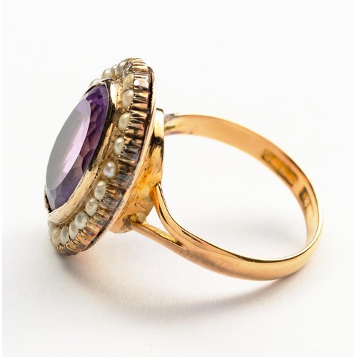 899 - AN AMETHYST AND SEED PEARL RING