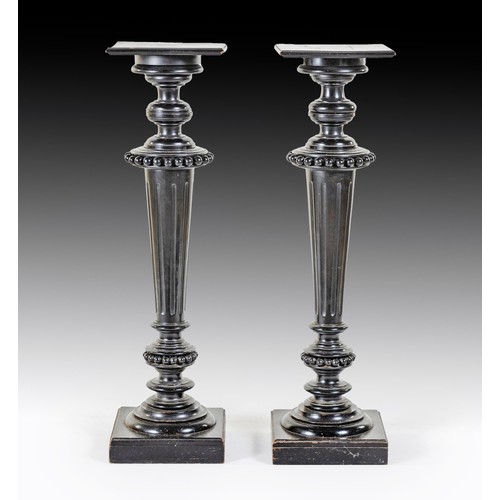 273 - A PAIR OF EBONISED PEDESTALS