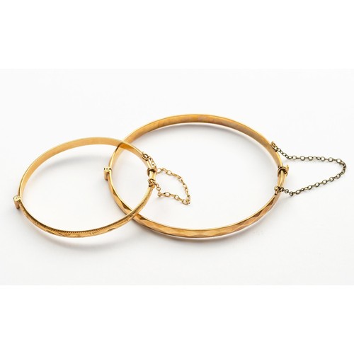 929 - TWO 9CT GOLD BRONZE-CORE HINGED BANGLES