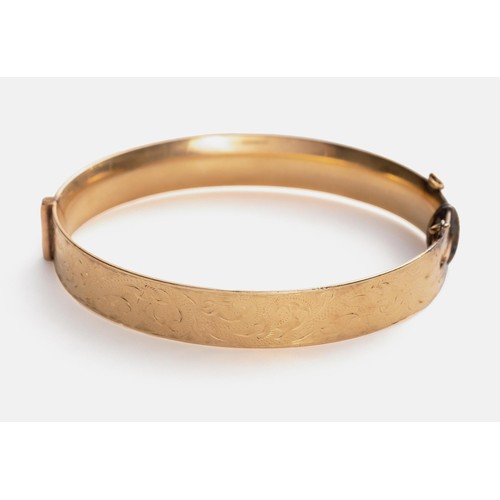 928 - A 9CT-GOLD BRONZE-CORE HINGED BANGLE