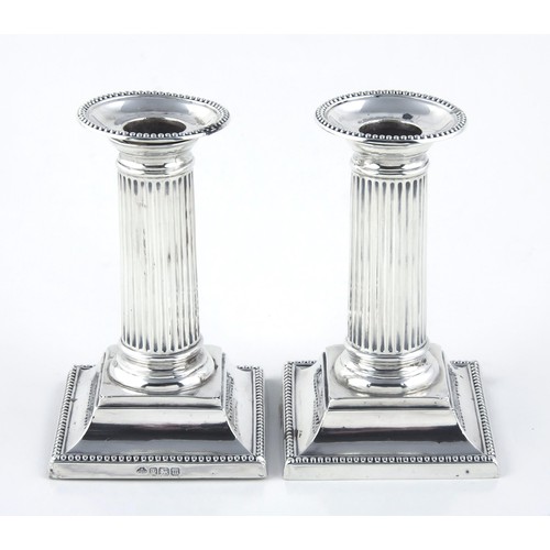 122 - A PAIR OF EDWARD VII SILVER CANDLESTICKS, WILLIAM HUTTON AND SONS, LONDON, 1904