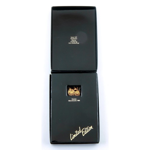 1722 - A 24CT GOLD BOXED MERCEDES BENZ CHARM