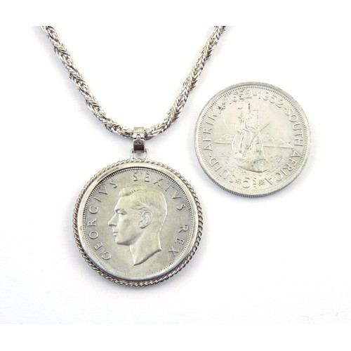 1703 - A SILVER COIN PENDANT AND SILVER COIN