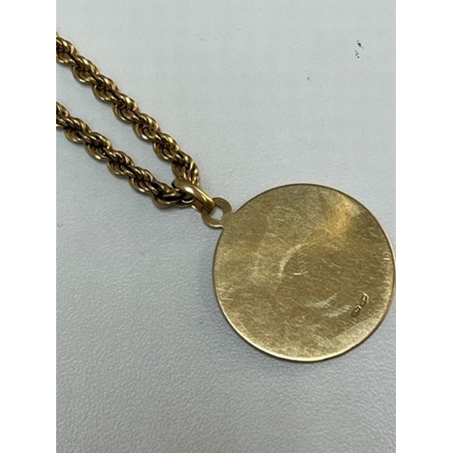 1753 - A GOLD PENDANT AND CHAIN