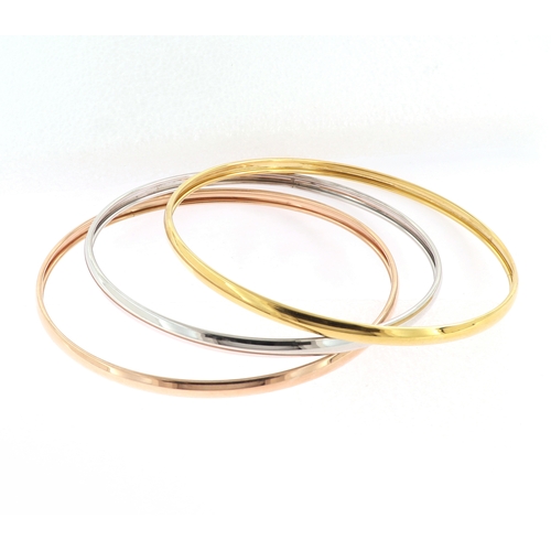 191 - A SET OF TRI COLOUR BANGLES