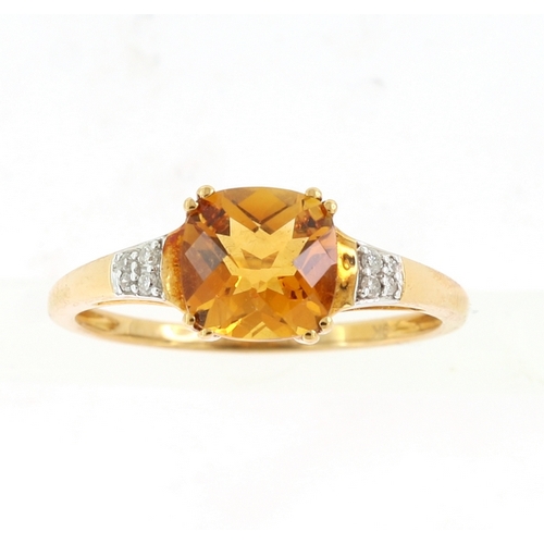 235 - A DIAMOND AND CITRINE RING