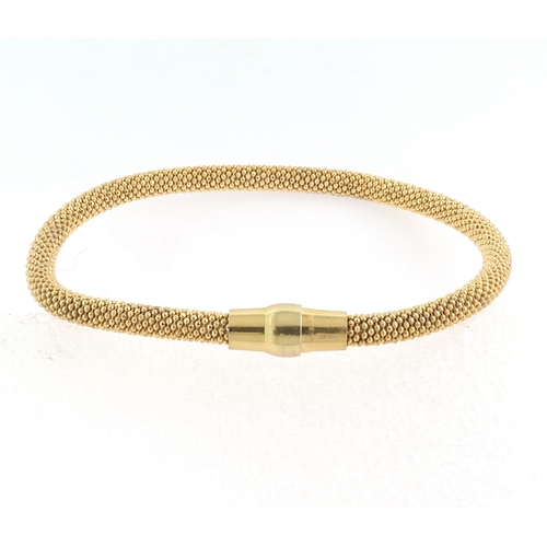 182 - A SILVER AND YELLOW GOLD POPCORN STYLE BRACELET