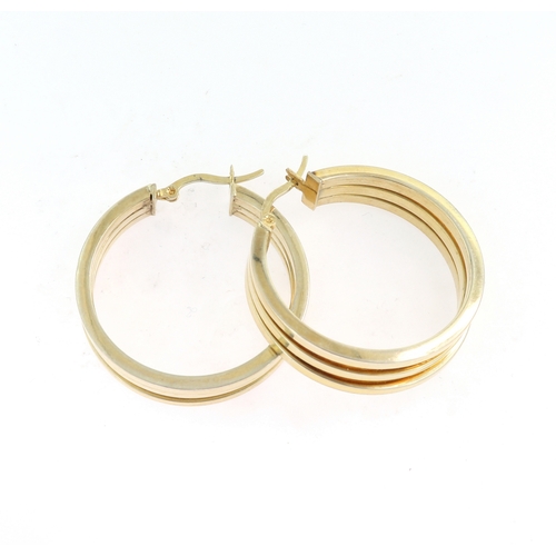 212 - A PAIR OF GOLD HOOP EARRINGS