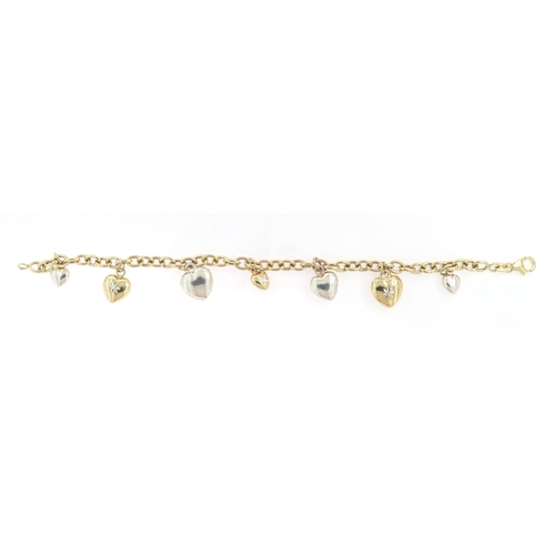 179 - A SILVER AND GOLD CHARM BRACELET