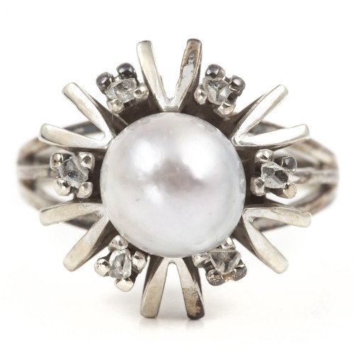 698 - A PEARL AND DIAMOND DRESS RING