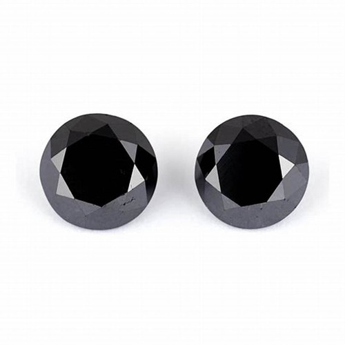 268 - A PAIR OF UNSET BLACK DIAMONDS, 1,31 CARATS