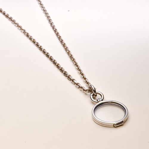 193 - A SILVER PENDANT AND CHAIN