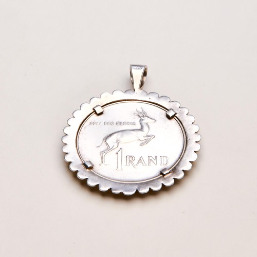 194 - A SILVER COIN PENDANT