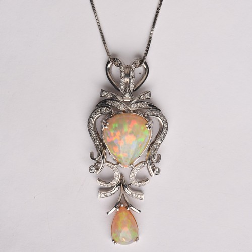 204 - AN OPAL AND DIAMOND PENDANT