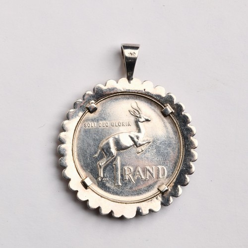 194 - A SILVER COIN PENDANT