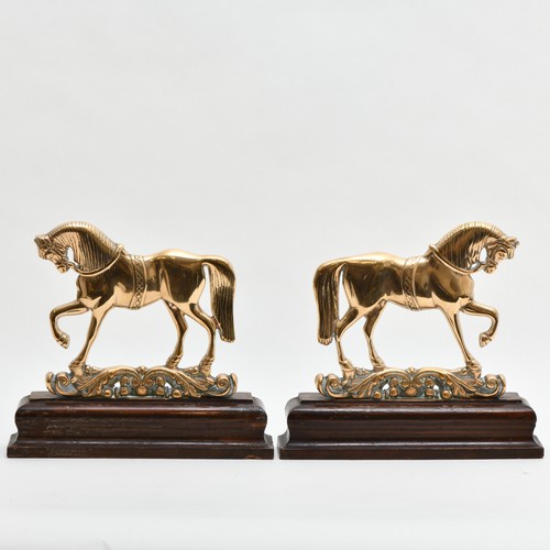 403 - A PAIR OF BRASS BOOK ENDS