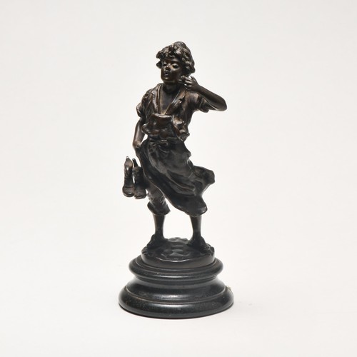 50 - A BRONZE FIGURAL STATUE OF A YOUNG MAN