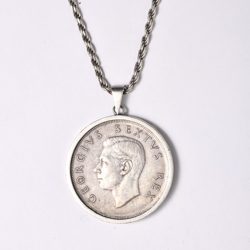 684 - A SILVER COIN PENDANT 