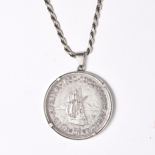 684 - A SILVER COIN PENDANT 