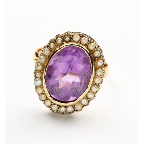 708 - AN AMETHYST AND SEED PEARL RING