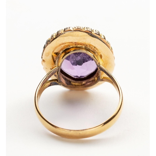 708 - AN AMETHYST AND SEED PEARL RING