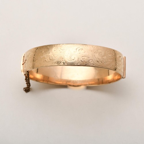 A GOLD-PLATED BANGLE, LONDON, 20TH CENTURY